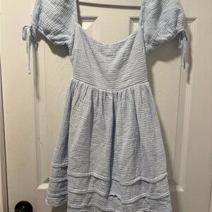 Woman’s blue dress